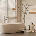 Freestanding White Bathtub In Minimalist Bathroom With Natural Light Green Plant And Wall Art