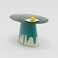 Coffee Table With Round Slate Top Teal Conical Base White Mountain Accents And Yellow Fruit