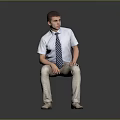 Man Sitting On Dark Surface Wearing Light Blue Shirt Striped Tie And Khaki Pants