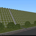 Green Grid Wall Structure With Bushes Grass And Pathway In Outdoor Area