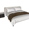 Modern Double Bed With Linen Bedding Pillows Brown Blanket And Black Nightstand