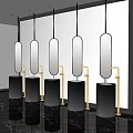 Modern Public Restroom Interior With Black Cylindrical Basins Oval Mirrors And Brass Faucets