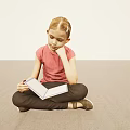 Child Girl Sitting Cross Legged on Floor Reading Book with Pink Shirt and Light Background