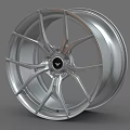 Stylish Silver Alloy Wheel Rim With Modern Spoke Design And Central Logo