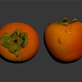 Two Fresh Persimmons With Green Calyx On Black Reflective Surface