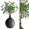 Black Ceramic Vase With Blue Blooming Flowers And Green Leaves For Home Decor