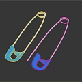 Two Shiny Silver Safety Pins With Blue Heads On Dark Background