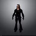 Man with long red hair in black outfit including long-sleeve top flared pants and gloves
