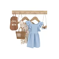 Stylish Clothing Hanger With Blue Ruffled Dress Woven Handbag And Camera Accessory