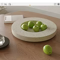 Ceramic Fruit Dish with Green Apples on Wooden Tabletop in Modern Home Interior