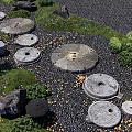 Japanese Zen Garden With Stone Millstones Pebble Pathway Lantern And Green Plants