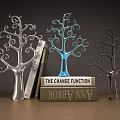 Tree Shaped Decorative Ornament Set with Silver Blue Dark and Stacked Books on Wooden Table