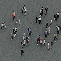 Group of People Casually Gathered on Gray Outdoor Ground Surface
