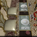 Luxurious Dining Table Set With Gold Accented Cream Seats Dark Wood Top And Red Tulips