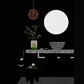 Modern Bathroom Interior With Black Walls Round Mirror Woven Vase Green Plants And Stone Sink
