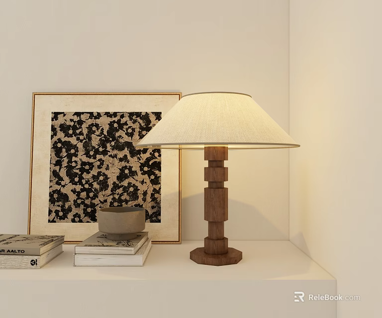 Wooden Base Table Lamp with Beige Lampshade on White Shelf Beside Decorative Painting and Books 3d model 