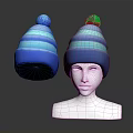 Blue Striped Knit Hat With Pom Pom Displayed On Mannequin Head