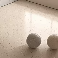 Light Colored Speckled Floor Tiles With Decorative Spheres Under Natural Light 3d model