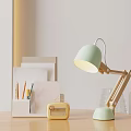 Light Green Desk Lamp With Yellow Vintage Radio And White Pen Holder On Desk