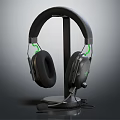 Black Over Ear Gaming Headphones With Comfortable Fit Green Accents Ergonomic Design On Stand
