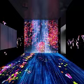 Immersive Art Installation In Dark Space With Colorful Light Effects And Flowing Petal Projections