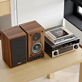 Natural Wood Finish Speakers On Wooden Table With Stereo System And Vinyl Records
