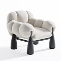 Modern Beige Upholstered Lounge Chair With Puffed Arms And Black Legs