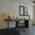 Modern Desk Design With Table Lamp Books Photo Frames Wall Art And Wicker Chair