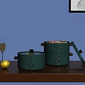 Green Cooking Pots With Golden Accents Open Lid Food Lemon Champagne Glass And Utensils
