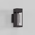 Modern Wall Sconce With Black Metal Frame And Glass Panel Emitting Warm Light