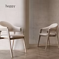 Two Modern Leisure Chairs with Fabric Upholstered Seats and Wooden Frame Against Light Colored Wall