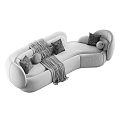 Curved Abstract shaped Sofa In Green And Beige With Soft Pillows And Throw Blanket