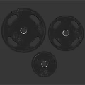 Black Weight Plates In Three Different Sizes For Home Daily Fitness Use