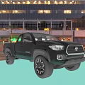 Black Toyota Pickup Truck With Off Road Wheels On Urban Street