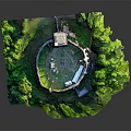 Ancient Circular Fortress With Central Tall Tower Surrounded By Green Vegetation