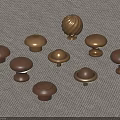 Various Wooden And Brass Mushroom Shaped Cabinet Knobs On Fabric Background 3d model
