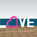 Outdoor Garden Ornament Featuring LOVE Letters Pink Heart And Couple By Sea Sunset View