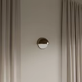Golden Half Moon Shaped Modern Wall Lamp On Beige Wall With Curtains
