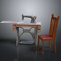 Vintage Sewing Machine On Wooden Worktable With Comfortable Wooden Chair