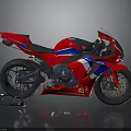 Red Honda Sport Motorcycle With Blue And White Stripes And Sleek Design