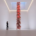Tall Red Decorative Ornament Set In White Room Interior With Chinese Characters