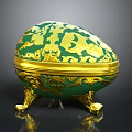 Elegant Display Shelf Featuring Green And Gold Decorative Egg Box With Intricate Ornate Patterns
