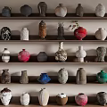 Decorative Ceramic Vessels Displayed on Shelves with Various Colors and Shapes