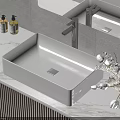 Modern White Bathroom Washbasin On Marble Countertop With Wooden Cabinet And Flower Vase