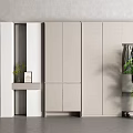 Modern White Shoe Cabinet With Sleek Design Storage Space Clothing Hanging Area And Green Plant