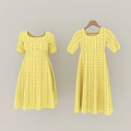 Yellow Short Sleeve Dresses with Eyelet Lace Pattern A Line Silhouette Hanging on Wooden Hanger