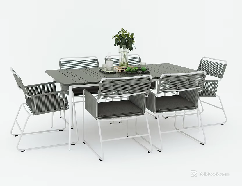 Modern Outdoor Table with Six Wicker Chairs and Vase of Green Plants 3d model 