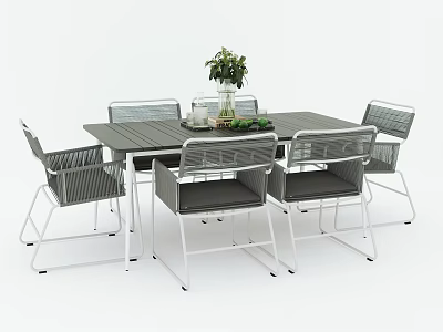 Modern Outdoor Table with Six Wicker Chairs and Vase of Green Plants 3d model