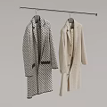 Two Coats Hanging on Hanger Black White Checkered Long and Beige Mid Length Grey Background