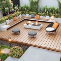 Modern Outdoor Garden With Seating Area Lush Green Plants Tall Trees And Stone Pathway